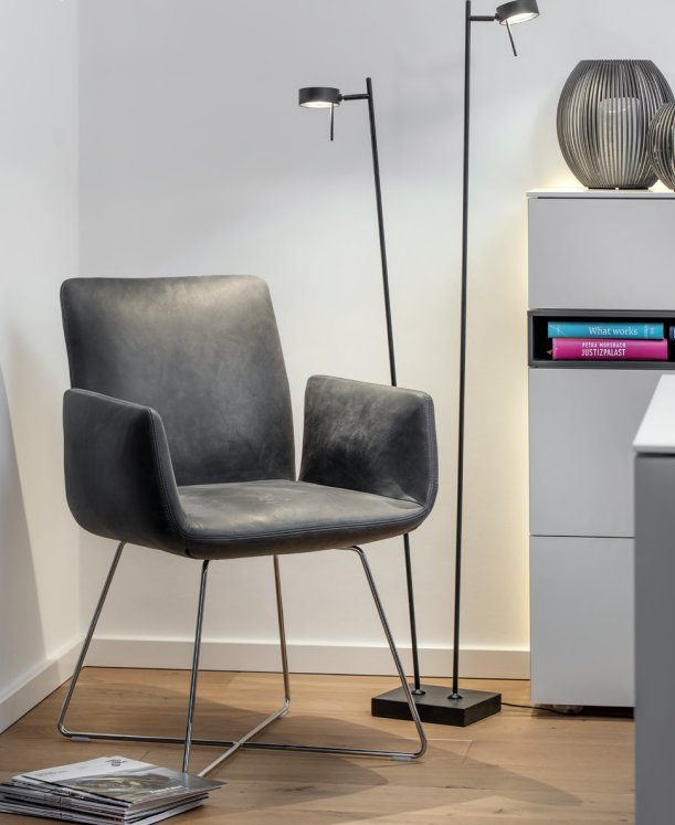 standing lamp beside single gray chair